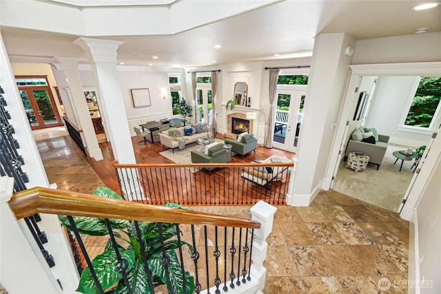 8380 SE 43rd St, Mercer Island, WA 98040 - interior space featuring a wealth of natural light, french doors, a glass covered fireplace, and decorative columns