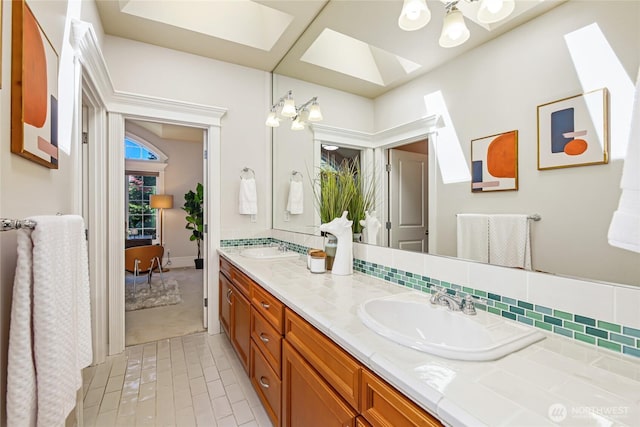 8380 SE 43rd St, Mercer Island, WA 98040 - full bath with a sink, double vanity, a skylight, and a healthy amount of sunlight