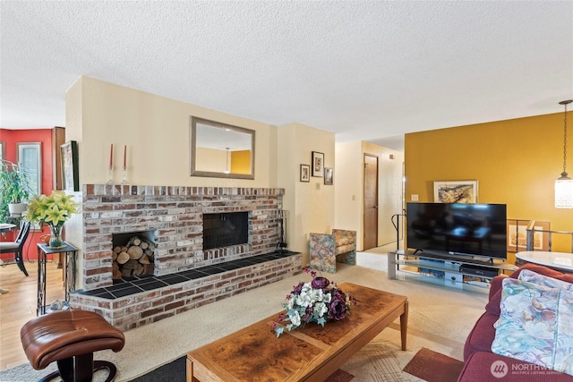 living area featuring a textured ceiling, a brick fireplace, and carpet floors
