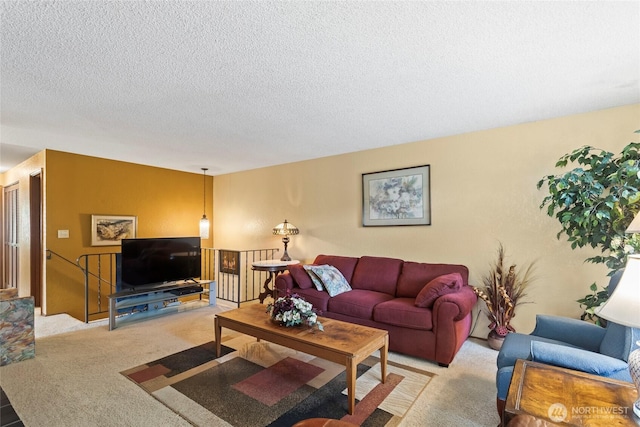 living room with carpet and a textured ceiling