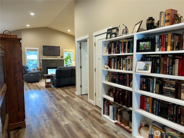 735 Dover Ct SE, Ocean Shores, WA 98569 - hallway featuring lofted ceiling, recessed lighting, and wood finished floors