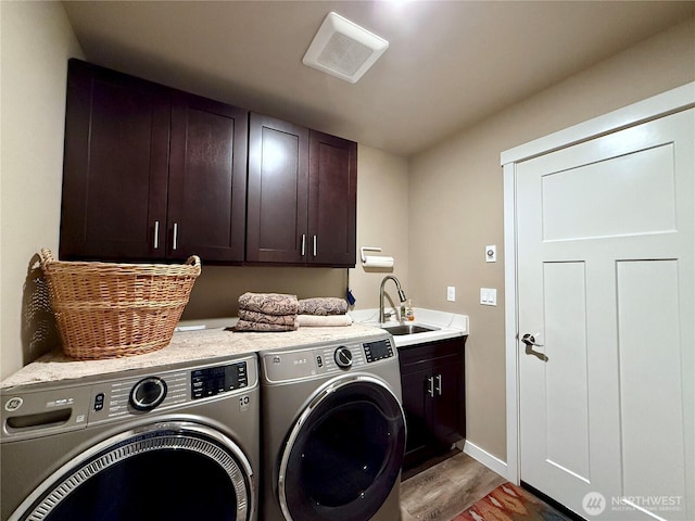 735 Dover Ct SE, Ocean Shores, WA 98569 - laundry room with cabinet space, washing machine and dryer, wood finished floors, and baseboards