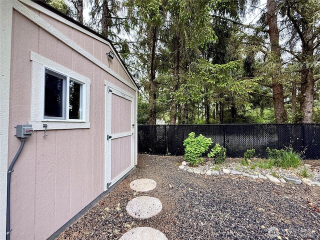 735 Dover Ct SE, Ocean Shores, WA 98569 - fenced backyard featuring an outbuilding and a shed