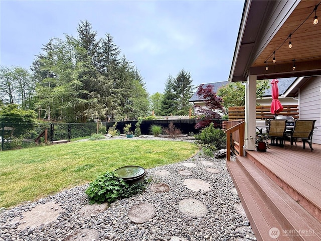 735 Dover Ct SE, Ocean Shores, WA 98569 - view of yard featuring outdoor dining area and a wooden deck