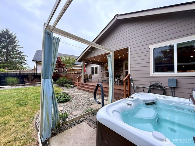 735 Dover Ct SE, Ocean Shores, WA 98569 - view of patio with a hot tub and a deck