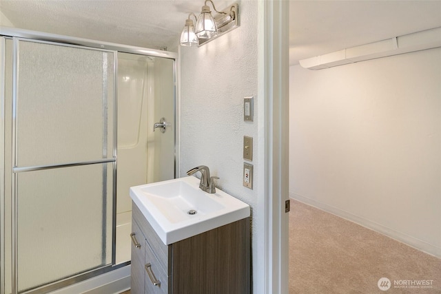 12635 Beacon Ave S, Seattle, WA 98178 - bathroom with a shower stall, vanity, and baseboards