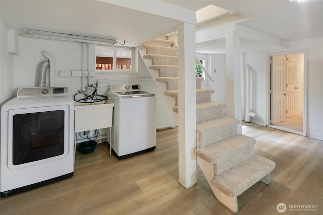 12635 Beacon Ave S, Seattle, WA 98178 - laundry room with light wood-style flooring, healthy amount of natural light, and washer and clothes dryer