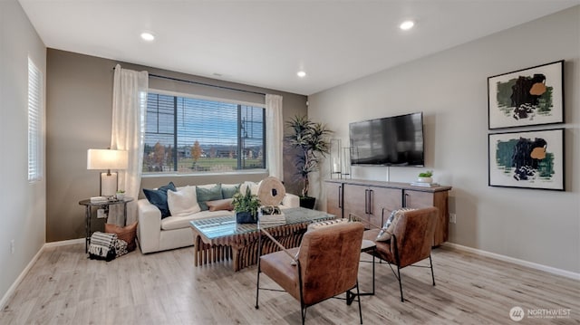 living room with baseboards, recessed lighting, and wood finished floors