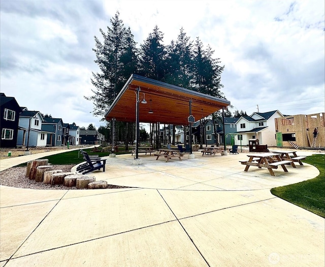 surrounding community with a gazebo and a residential view