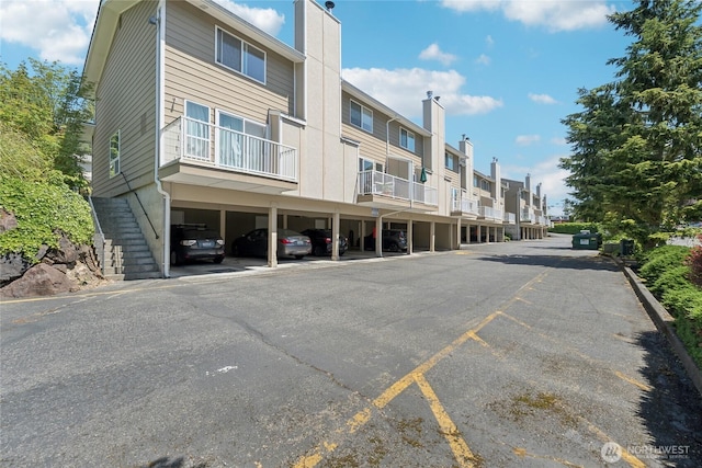 18530 52nd Ave W Unit D2, Lynnwood, WA 98037 - view of property featuring a residential view and covered parking