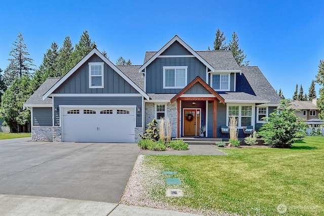 1827 Double Ditch Ct, Lynden, WA 98264 - craftsman-style house featuring asphalt driveway, a front lawn, a porch, and a shingled roof