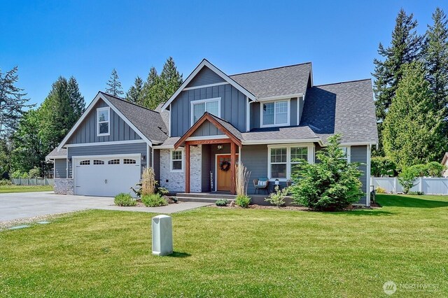 1827 Double Ditch Ct, Lynden, WA 98264 - view of front facade with driveway, board and batten siding, a shingled roof, and a garage