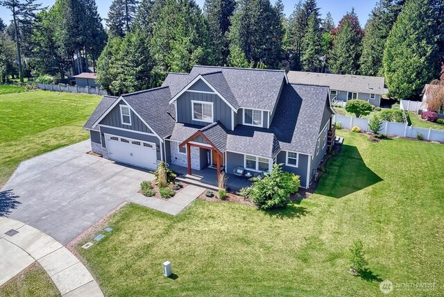 1827 Double Ditch Ct, Lynden, WA 98264 - view of front of property featuring board and batten siding, driveway, a shingled roof, and covered porch