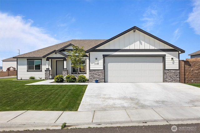 3504 Kathren Ln, Pasco, WA 99301 - view of front facade featuring an attached garage, stone siding, concrete driveway, board and batten siding, and roof with shingles