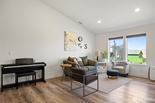 3504 Kathren Ln, Pasco, WA 99301 - living area with lofted ceiling, recessed lighting, wood finished floors, and baseboards