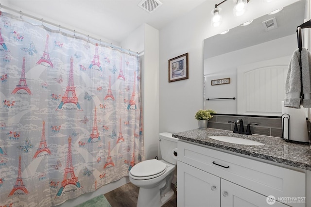 3504 Kathren Ln, Pasco, WA 99301 - full bath with toilet, vanity, wood finished floors, and curtained shower