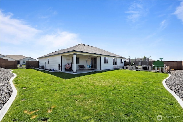3504 Kathren Ln, Pasco, WA 99301 - back of property with a patio and a trampoline