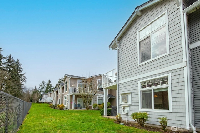 view of property exterior with central AC unit and a balcony