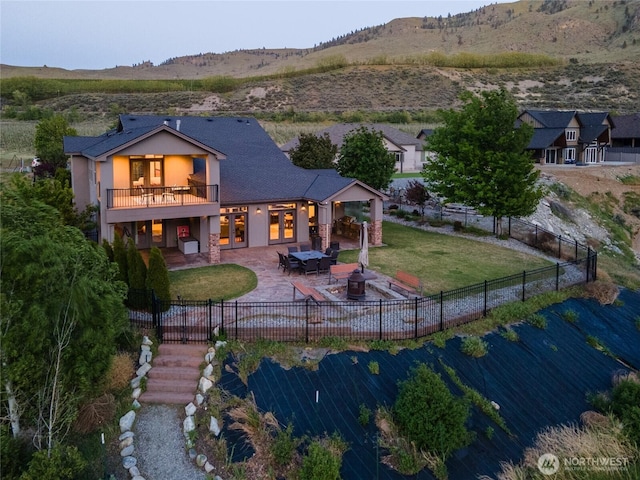 31 S Shore Dr, Orondo, WA 98843 - back of house featuring a patio, stucco siding, a balcony, a mountain view, and french doors