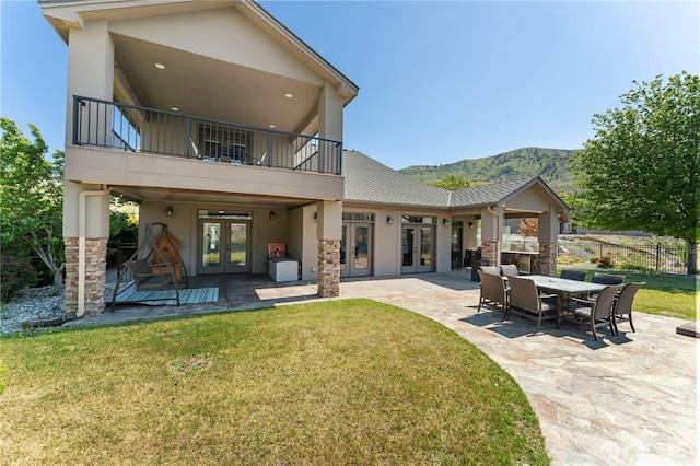 31 S Shore Dr, Orondo, WA 98843 - back of property with french doors, stucco siding, a balcony, and a patio