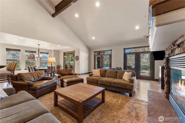 31 S Shore Dr, Orondo, WA 98843 - living room featuring beam ceiling, high vaulted ceiling, recessed lighting, a fireplace, and wood finished floors