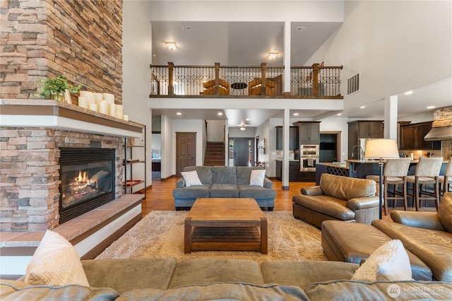 31 S Shore Dr, Orondo, WA 98843 - living area with a high ceiling, a stone fireplace, and light wood finished floors
