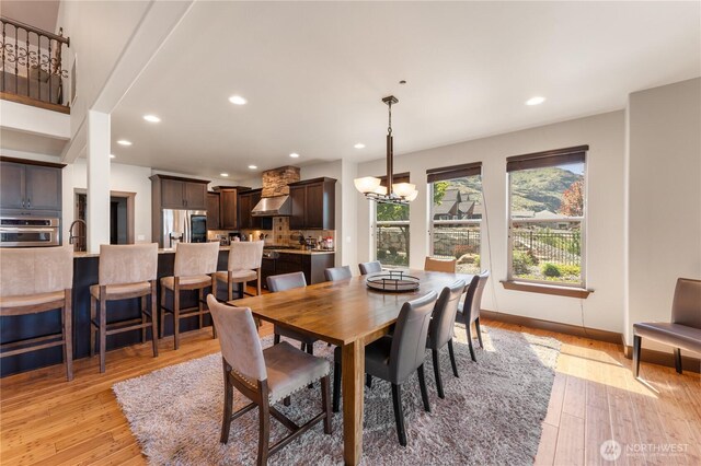 31 S Shore Dr, Orondo, WA 98843 - dining room with a chandelier, recessed lighting, light wood finished floors, and baseboards