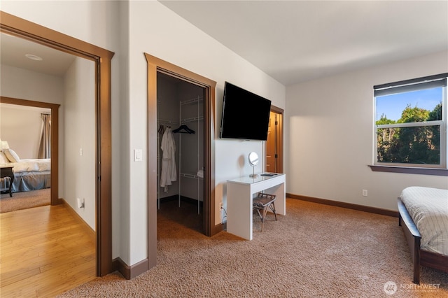 31 S Shore Dr, Orondo, WA 98843 - bedroom featuring a spacious closet, light colored carpet, a closet, and baseboards