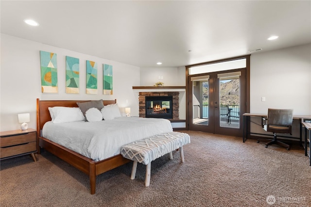 31 S Shore Dr, Orondo, WA 98843 - carpeted bedroom featuring access to outside, recessed lighting, french doors, an office area, and a fireplace