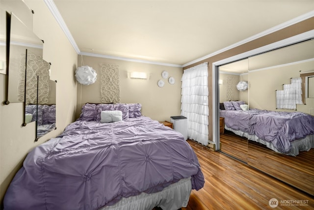 bedroom featuring wood finished floors and ornamental molding