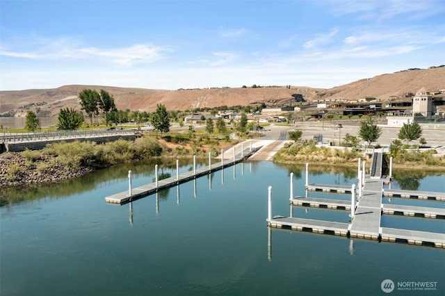 dock with a water and mountain view
