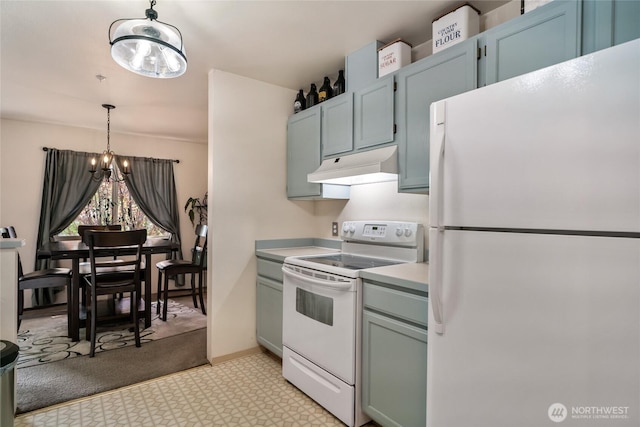 kitchen with a notable chandelier, pendant lighting, under cabinet range hood, white appliances, and light countertops