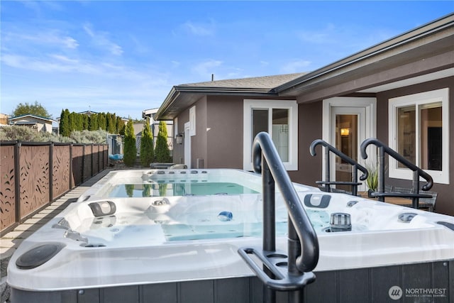 419 Edgewater Way SW, Mattawa, WA 99349 - view of side of property with a hot tub, fence, and stucco siding