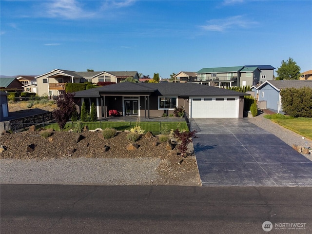 419 Edgewater Way SW, Mattawa, WA 99349 - view of front facade with a residential view, an attached garage, and driveway
