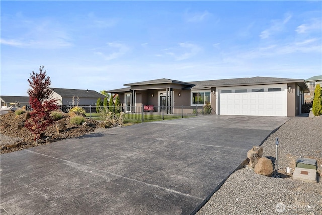 419 Edgewater Way SW, Mattawa, WA 99349 - view of front facade with stucco siding, concrete driveway, a garage, and fence