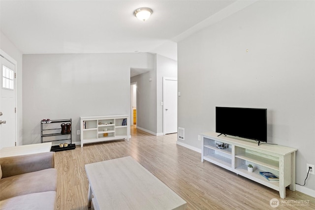 592 Kodiak Ave, Camano Island, WA 98282 - living room with vaulted ceiling, visible vents, wood finished floors, and baseboards