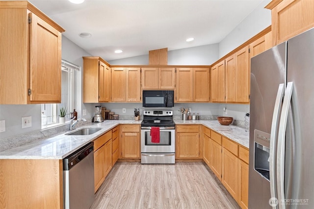 592 Kodiak Ave, Camano Island, WA 98282 - kitchen with light wood-style floors, appliances with stainless steel finishes, light brown cabinets, and a sink