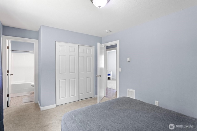 592 Kodiak Ave, Camano Island, WA 98282 - carpeted bedroom with baseboards, a closet, and visible vents