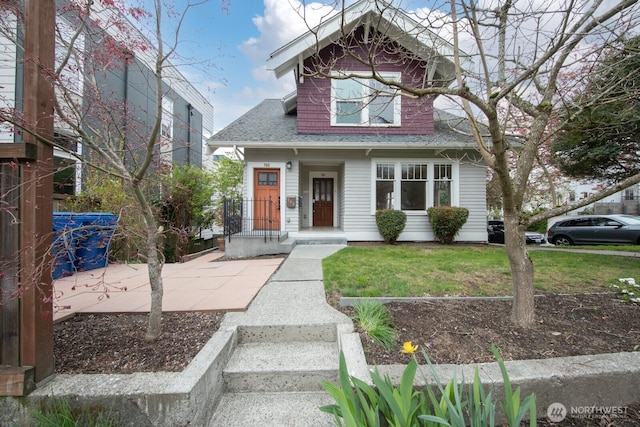 703 18th Ave S, Seattle, WA 98144 - bungalow-style house with a shingled roof and a front yard