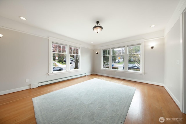 703 18th Ave S, Seattle, WA 98144 - unfurnished room with a baseboard radiator, wood finished floors, baseboards, and recessed lighting