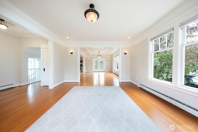 703 18th Ave S, Seattle, WA 98144 - unfurnished room featuring a baseboard radiator, plenty of natural light, wood finished floors, crown molding, and baseboards