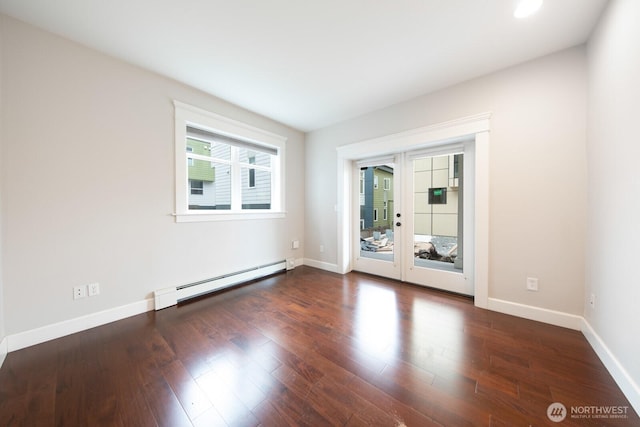 703 18th Ave S, Seattle, WA 98144 - empty room with a baseboard heating unit, french doors, baseboards, and wood finished floors