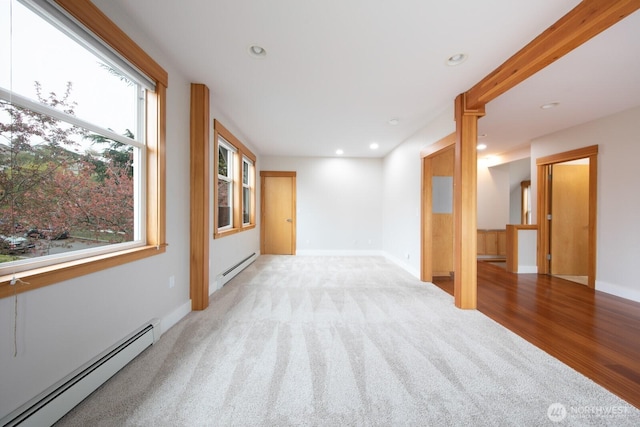 703 18th Ave S, Seattle, WA 98144 - empty room featuring a baseboard radiator, carpet flooring, recessed lighting, and baseboards