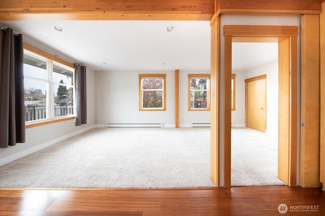 703 18th Ave S, Seattle, WA 98144 - unfurnished living room featuring carpet, baseboard heating, baseboards, and recessed lighting