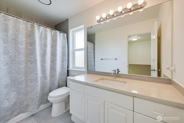 16886 Wales St SE, Monroe, WA 98272 - full bathroom featuring tile patterned flooring, toilet, and vanity