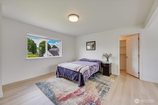 16886 Wales St SE, Monroe, WA 98272 - bedroom with wood finished floors, baseboards, and a spacious closet