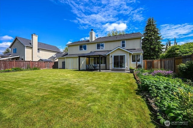 16886 Wales St SE, Monroe, WA 98272 - back of property with a patio and a chimney