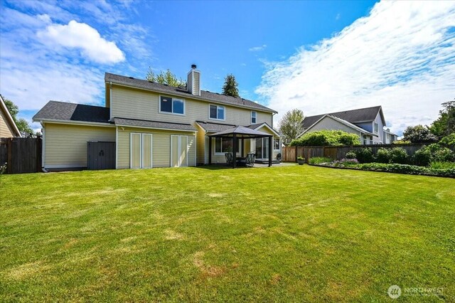 16886 Wales St SE, Monroe, WA 98272 - back of house featuring a gazebo and a chimney