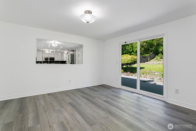 15221 42nd Ave E, Tacoma, WA 98446 - empty room featuring wood finished floors and baseboards