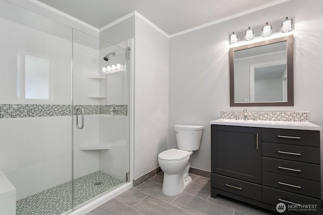 15221 42nd Ave E, Tacoma, WA 98446 - full bath with crown molding, toilet, a shower stall, vanity, and tile patterned flooring